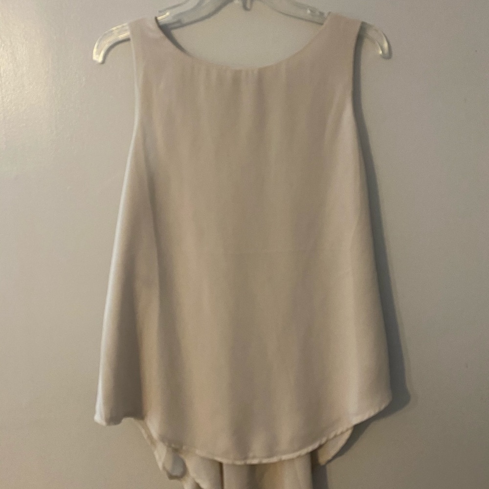 Tan Sleeveless blouse. Size L. 100% polyester.